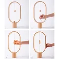 Stolná lampa Heng Balance Ellipse, čierna, 5V/1A, teplá biela, USB, s vypínačom vo vzduchu,