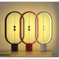 Ďalší obrázok produktu Stolná lampa Heng Balance Ellipse, čierna, 5V/1A, teplá biela, USB, s vypínačom vo vzduchu,